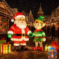 Ensemble de lanternes géantes LED représentant Père Noël et les elfes pour la décoration artistique en soie des célébrations de Noël en plein air sur les places publiques