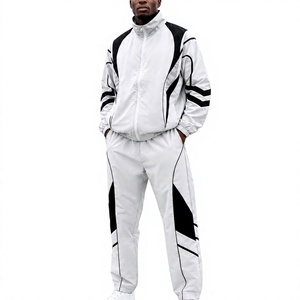 Ensemble de survêtement sportif pour homme, blanc et noir, avec blocs de couleur, fermeture éclair intégrale, léger, en polyester, deux pièces avec poches latérales - Product Image 1