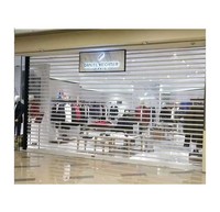 Porte commerciale de conception moderne à volet roulant en aluminium transparent polycarbonate verre acier automatique pour les centres commerciaux intérieurs et extérieurs