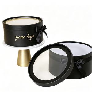 Boîte cadeau ronde noire personnalisée avec couvercle transparent et nœud en ruban pour emballage cadeau avec impression de logo en feuille d'or - Product Image 1