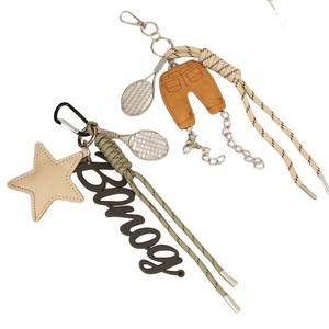 Mengda Miu Style Mode Mini PU <span class=keywords><strong>Pantalon</strong></span> Anglais Lettre <span class=keywords><strong>Raquette</strong></span> Sac Pendentif Accessoire Ins Étoile À Cinq Branches Tressé Porte-clés - Product Image 1