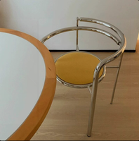 Chaise de salle à manger de style moderne du milieu du siècle pour bureau à domicile |   Fauteuil minimaliste italien en acier inoxydable avec dossier design