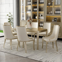 Table à manger en bois massif de luxe chinois moderne avec plateau en marbre et chaises dorées champagne, ensemble complet de la marque Han Yuan