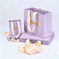 Fournisseur de sacs en papier violet clair personnalisés de luxe avec poignées en ruban pour cosmétiques, lotions, maquillage, rouges à lèvres, perruques, cadeaux et shopping