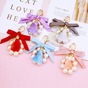 <span class=keywords><strong>Gros</strong></span> femmes grande perle noeud papillon sac <span class=keywords><strong>porte</strong></span>-clés cadeau tissu noeud noeud gland perle <span class=keywords><strong>porte</strong></span>-clés pour sac - Product Image 1