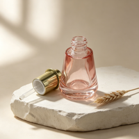 Flacon d'essence en verre rose trapézoïdal à fond épais de 30 ml, pompe compte-gouttes plaquée or, emballage de luxe pour sérum réparateur de soins de la peau