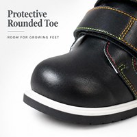 Chaussures montantes orthopédiques noires pour enfants avec fermeture auto-agrippante réglable, bout arrondi et semelle extérieure stable pour l'école