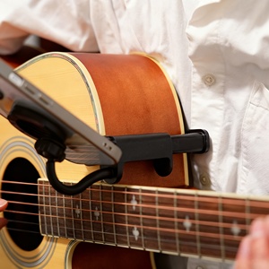 Soporte Ajustable para Teléfono Celular con Forma de Ukelele para Instrumentos de 2.36-3.46 Pulgadas, Soporte para Partituras, Ideal para Música Electrónica - Product Image 1