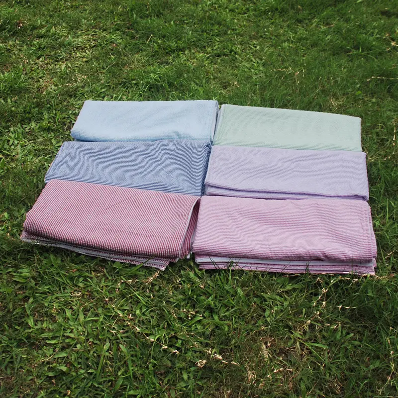 थोक ग्रीष्मकालीन अच्छी गुणवत्ता वाला मोनोग्रामयुक्त नरम आयत 27*60 इंच सेसरकर बीच तौलिया DOM209