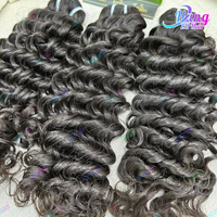 Paquets de cheveux bruts vierges humains de qualité vietnamienne 15A paquets de cheveux indiens bruts bouclés Extension de cheveux humains