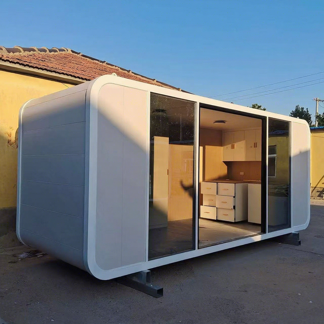 Stylish Apple Capsule Pod with Glass Facade and Solar Power for Sustainable Living Spaces