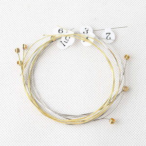 Petites <span class=keywords><strong>cordes</strong></span> de harpe en plastique doré durables pour instruments à <span class=keywords><strong>cordes</strong></span> avec emballage en plastique - Product Image 1