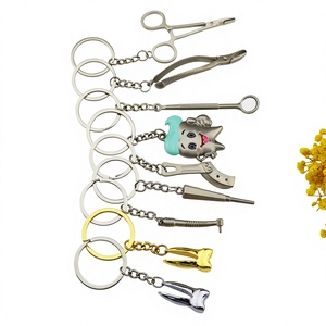 Porte-clés personnalisé en alliage de zinc, petit pendentif dentaire mignon, cadeau promotionnel pour événement dentaire, porte-clés créatif en forme de dent dorée - Product Image 1