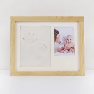 Hot selling quarter new product, hand and foot prints of newborn babies solid wood printing mud photo frame, exquisitely crafted