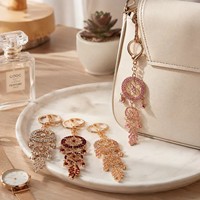 Nouveau porte-clés attrape-rêves créatif multicouche en strass, pendentif plume en alliage de zinc, breloque de sac bohème, ornement cadeau