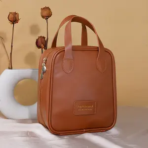 Sac cosmétique à fermeture éclair en cuir PU personnalisé de style élégant sac de maquillage rose étanche de voyage en plein air avec poignée