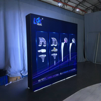 Stand d'exposition professionnel modulaire avec cadre en aluminium, graphisme à bords en silicone, éclairage LED haute intensité SEG et boîte à lumière Pop Light
