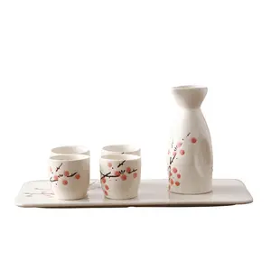 Japanese style Sake set porcelain decanter with four sake cups for warm and cool sake