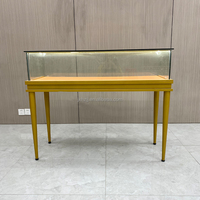 Vitrine de présentation de montres et bijoux personnalisée en gros, éclairage LED tricolore, cadre en acier inoxydable, verre trempé, logo personnalisé