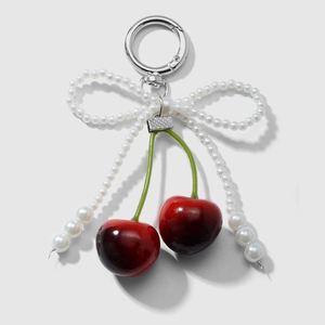 Porte-clés tendance en dentelle avec nœud papillon et pendentif cerise, breloque bijou pour filles et femmes, cadeau idéal - Product Image 4