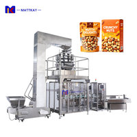 Machine d'emballage verticale automatique multi-têtes pour snacks, noix, flocons d'avoine, avec formage, remplissage, scellage et cartonnage