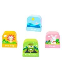 Vente en gros Intoss YZ008 Tampon nominatif en plastique au design de dessin animé mignon en forme de poupée, logo personnalisé, pour vêtements d'enfants, éponge photosensible