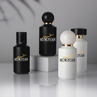 Flacons de parfum vides cylindriques noirs et blancs de luxe 50 ml 100 ml avec pulvérisateur à pompe rechargeable pour huiles essentielles et parfums