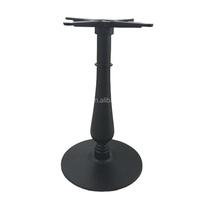 Table basse ronde en forme de vase en fonte noire