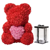 Meilleure vente : Ours en peluche rose artificiel avec fleurs en PE de 25 cm et boîte cadeau transparente