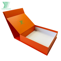 Caja de regalo de exhibición de ropa de lujo de papel plegable con imán naranja personalizado, caja de regalo Premium para embalaje de ropa