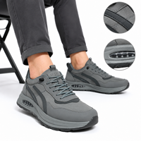 Baskets basses de marche en plein air avec semelle épaisse à coussin d'air et design rayé noir et gris, chaussures décontractées pour hommes