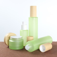 Bouteille de toner en verre cosmétique verte de marque privée impression en soie pot de lotion vide de luxe finition mate bouchon à vis sérum de soin de la peau
