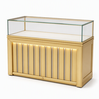 Vitrine de présentation de bijoux sur mesure en gros avec éclairage LED, finition dorée et verre haute transparence