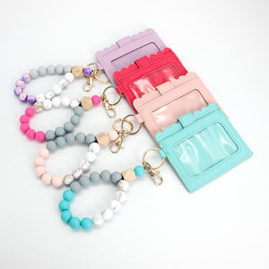 Vente chaude Silicone Voiture Portefeuille Perlé Bracelet Titulaire De La Carte Femmes Filles Bracelet En Cuir PU Gland <span class=keywords><strong>Porte</strong></span>-clés - Product Image 1