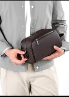 Pochette de voyage en cuir PU pour homme, sac à main d'affaires, pochette antivol, mode, avec serrure à code, grande capacité, dragonne, fermeture éclair, portable