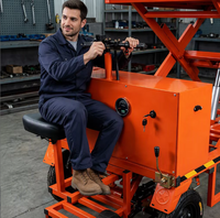 Chariot à plateforme électrique à ciseaux à quatre roues en acier 1200W, capacité 500kg, avec fonction de marche arrière, pour usage industriel