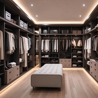 Dressing moderne noir de luxe avec armoire, tabouret en velours capitonné et tapis, intérieur luxueux avec éclairage LED