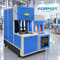 Machine de soufflage de bouteilles PET semi-automatique pour la production de bouteilles d'eau, de boissons et de jus avec contrôle PLC