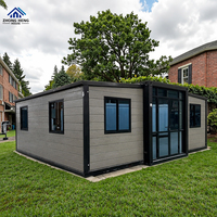 Casa Contenedor Hidráulica Expandible con Chasis de Remolque, Panel Gris Móvil, Patas Niveladoras, Puerta de Doble Cristal