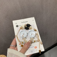 Petite montre-bracelet en alliage pour femme, écologique, artistique, à mouvement à quartz, style dessin animé mignon et de niche, idéale pour les meilleures amies et les étudiantes