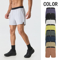 Shorts de sport unisexes anti-transpiration 90/10 Poly Spandex avec poche zippée et fente latérale pour l'entraînement physique