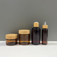 Emballage cosmétique Pot de miel de qualité alimentaire 100ml 250ml Pot de crème en plastique pour animaux de compagnie avec couvercle en bambou véritable