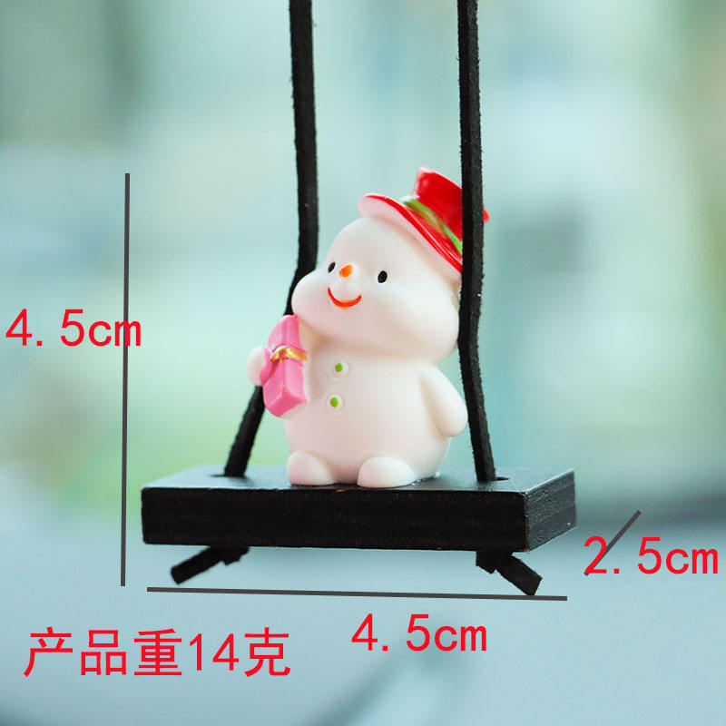 มนุษย์หิมะถือกล่องของขวัญสีชมพู