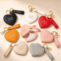 Porte-clés miroir en cuir PU en forme de cœur personnalisé, miroir de poche cosmétique portable avec logo personnalisé pour cadeau promotionnel