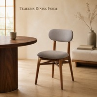 Chaise de salle à manger moderne, structure en bois massif couleur noyer, assise et dossier arrondis en tissu gris, pour usage en café.