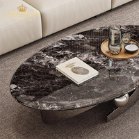 Table basse de salon moderne italienne de luxe léger, avec pieds en acier inoxydable argenté et plateau en pierre frittée ovale