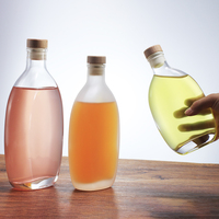 Bouteille d'eau en verre de forme spéciale 250ml 500ml 750ml avec bouchon personnalisable, impression sablée, logo, conteneur vide pour jus et boissons