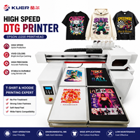 Imprimante DTG haute vitesse à quatre stations avec têtes d'impression I3200 pour l'impression de motifs personnalisés sur t-shirts en coton pur textile