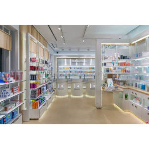 Étagères de <span class=keywords><strong>pharmacie</strong></span> blanches avec lumières, décoration de meubles de magasin de <span class=keywords><strong>pharmacie</strong></span> personnalisé, boîte d'éclairage supérieure, exposition murale de médecine à vendre - Product Image 1