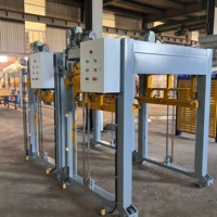 Système automatique de transfert et d'empilage de palettes pour les usines de blocs